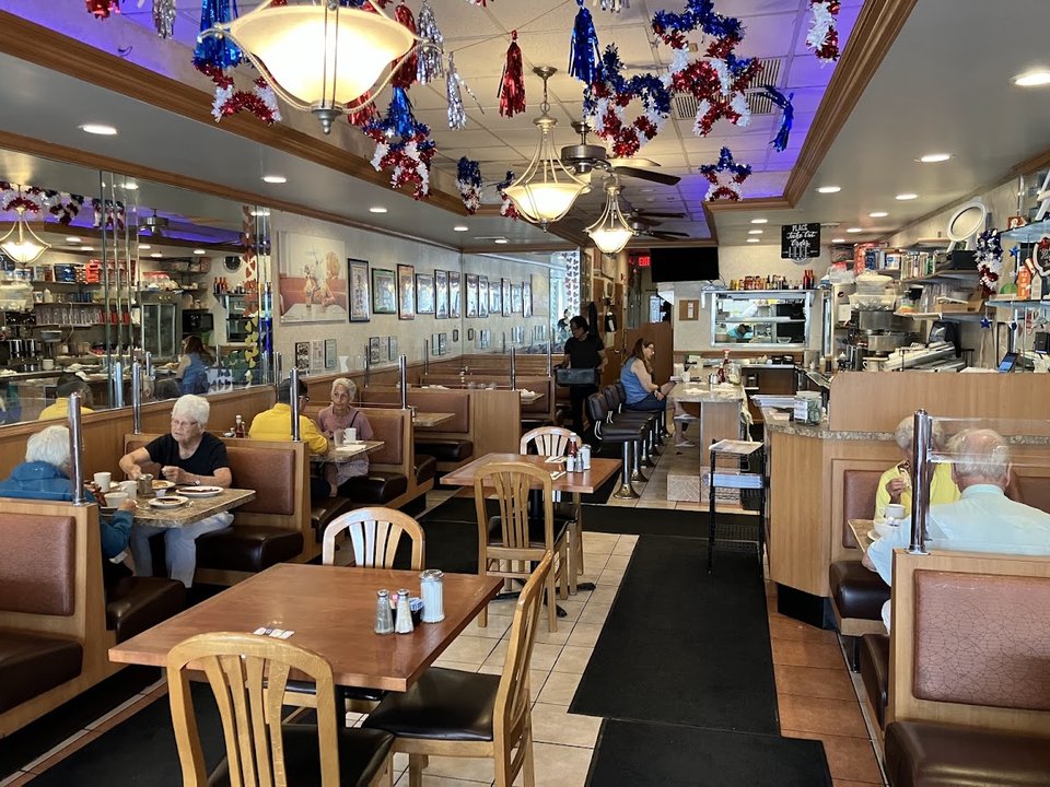 Booth seating inside a casual diner.